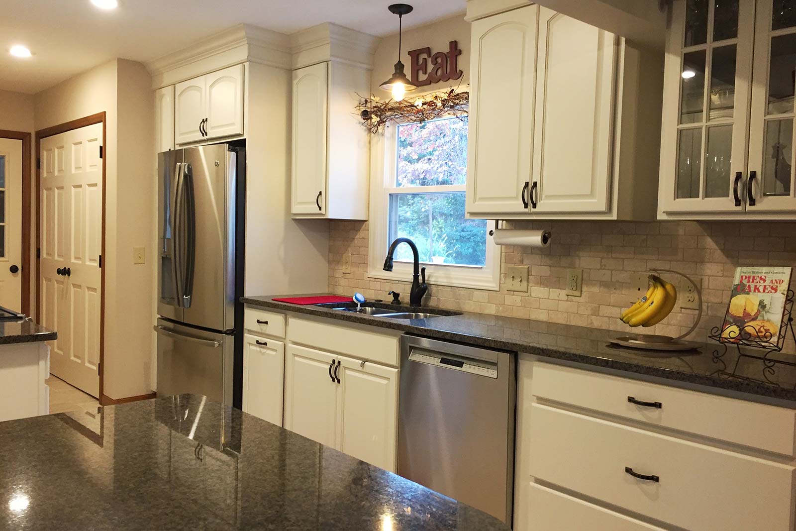 Kitchen remodeled with black granite countertops